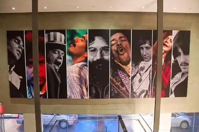 a collage of photos offamousfamous actors on a wall at Andaz West Hollywood, By Hyatt in Los Angeles