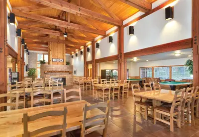 a restaurant with tables and chairs and a pool table at WorldMark Big Bear Lake in Big Bear Lake