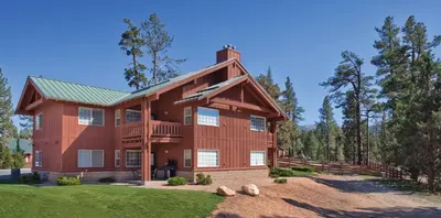 a large wooden house with a green roof at WorldMark Big Bear Lake in Big Bear Lake