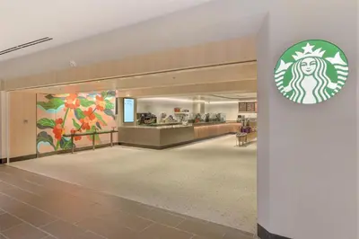 a lobby of a store with a sign on a wall at Hilton Anaheim in Anaheim