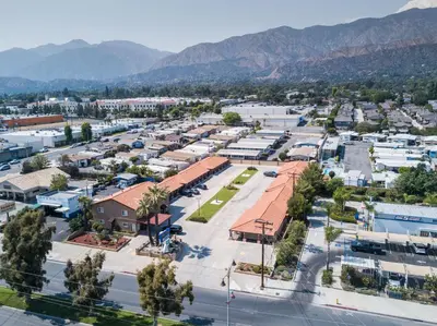 an aerial view of a town with mountains in the background at Oak Park Motel in Monrovia