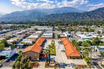 an aerial view of a town with mountains in the background at Oak Park Motel in Monrovia