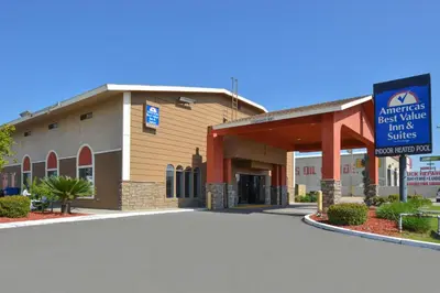 a building with a sign in front of it at Americas Best Value Inn & Suites-East Bakersfield in Bakersfield