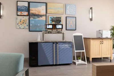 a waiting room with a computer and a desk at Homewood Suites by Hilton Ontario Rancho Cucamonga in Rancho Cucamonga