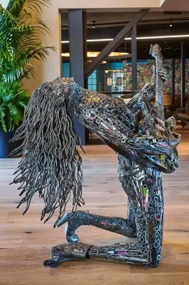a metal statue of a person standing on a skateboard at Hotel Ziggy On Sunset in Los Angeles