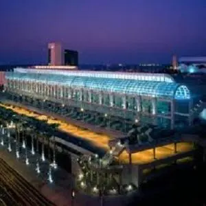 a large building with a train station at night at Beacon Motel in Long Beach