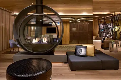a living room with a fireplace and a couch at Kimpton Hotel Palomar Los Angeles Beverly Hills by IHG in Los Angeles