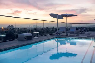 a swimming pool on the roof of a building at The Godfrey Hotel Hollywood in Los Angeles