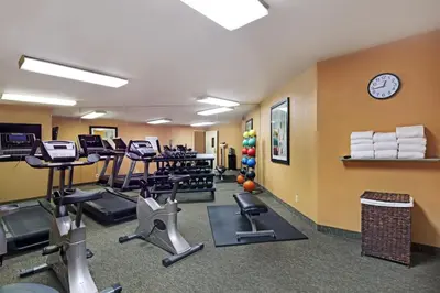 a gym with treadmills and exercise equipment in a room at Holiday Inn Express Port Hueneme by IHG in Port Hueneme