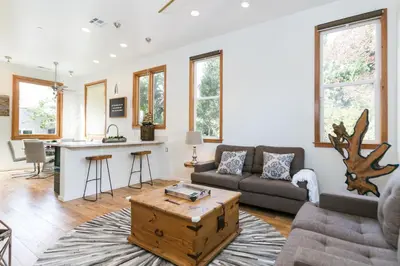 a living room with a couch and a table at Stunning 2-Bedroom Home near Downtown Culver in Los Angeles