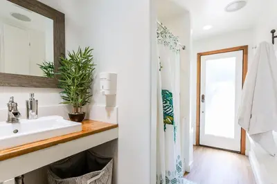 a bathroom with a sink and a mirror at Charming 1-Bedroom Home near Downtown Culver in Los Angeles
