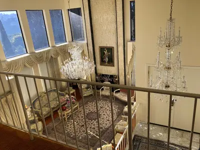 a room with two chandeliers and a staircase at Hollywood Hills private room in Los Angeles