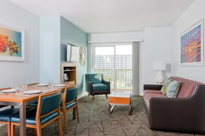 a living room with a table and a couch at WorldMark Anaheim in Anaheim