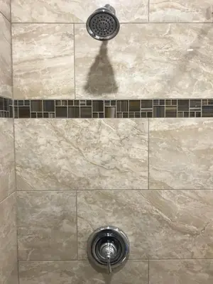 a shower with a shower head and a drain at Viking Motel-Ventura in Ventura