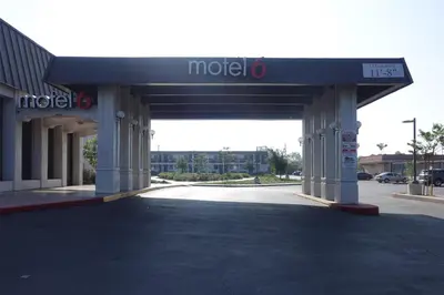 a mobil station with a sign on top of it at Motel 6-Claremont, CA in Claremont
