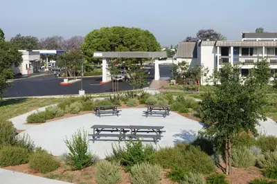 a group of picnic tables in a park at Motel 6-Claremont, CA in Claremont