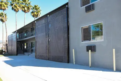 a building with a gate on the side of it at Tilbury Inn in Glendale