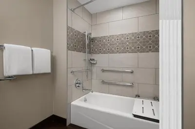 a bathroom with a white tub and a shower at Hyatt Regency Westlake in Westlake Village