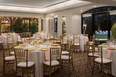 a set up for a wedding reception in a room with tables and chairs at Hyatt Regency Westlake in Westlake Village