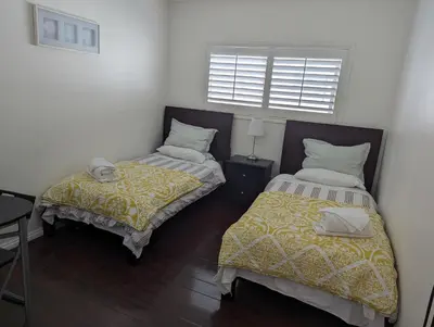 a bedroom with two beds and a window at 2Bedroom with Den and 2BA 4 Blocks to Santa Monica Beach in Los Angeles
