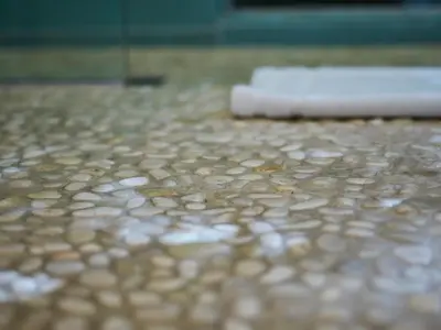 a close up of a tile floor with a towel at Palms Place in Los Angeles