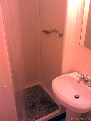 a bathroom with a sink and a toilet and a shower at Ranch Motel in Tehachapi