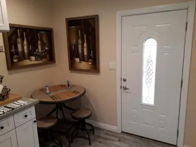 a kitchen with a table and a white door at Comfortable Luxury Studio in Los Angeles