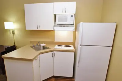 a kitchen with a white refrigerator and a sink at Extended Stay America Suites - Orange County - Anaheim Convention Center in Anaheim