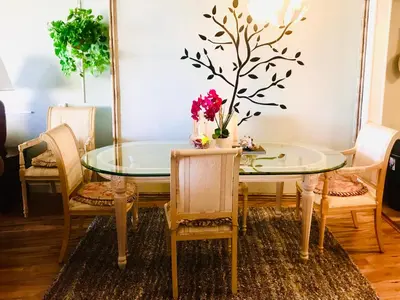 a dining room with a glass table and chairs at Fantastic Marina View in Front of My Window! in Los Angeles