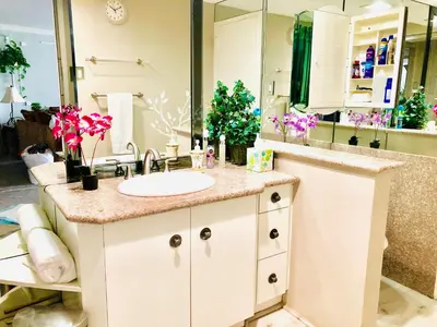 a bathroom with a sink and a large mirror at Fantastic Marina View in Front of My Window! in Los Angeles