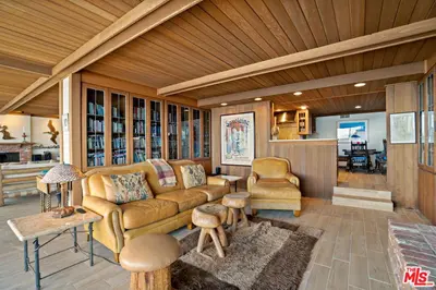 a living room with a couch and a table at Villa Rylee in Malibu
