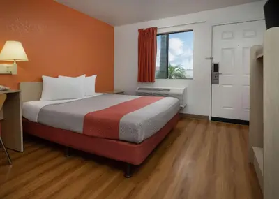 a hotel room with a bed and a window at Motel 6-Buena Park, CA - Knotts Berry Farm - Disneyland in Buena Park