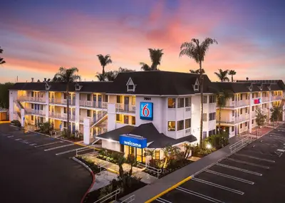 an aerial view of a hotel with a parking lot at Motel 6-Buena Park, CA - Knotts Berry Farm - Disneyland in Buena Park