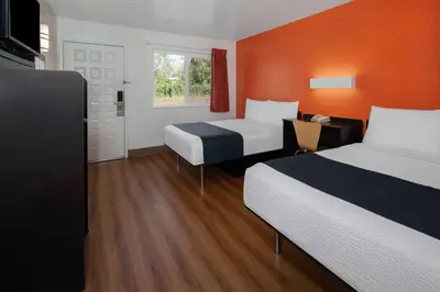 a hotel room with two beds and a window at Motel 6-Carpinteria, CA - Santa Barbara - South in Carpinteria