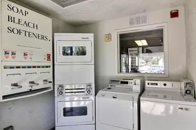 a kitchen with white appliances in a room at Motel 6-Carpinteria, CA - Santa Barbara - South in Carpinteria