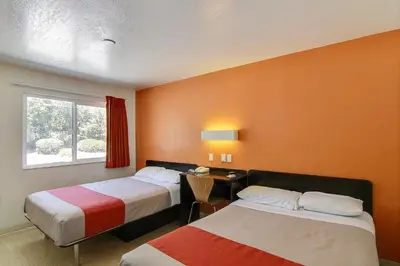 a hotel room with two beds and a window at Motel 6-Carpinteria, CA - Santa Barbara - South in Carpinteria