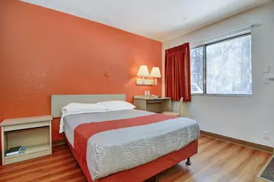 a hotel room with a bed and a window at Motel 6-Big Bear Lake, CA in Big Bear Lake