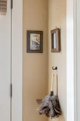 a broom hanging on a wall in a room at Casita Gundry- Boutique Hideaway, Quaint Historic Charm in Long Beach