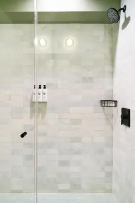 a bathroom with a shower with a glass door at Palihotel Hollywood near Universal Studios in Los Angeles