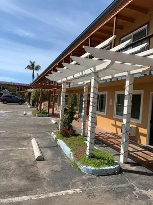 a parking lot in front of a building at Sandyland Reef Inn in Carpinteria