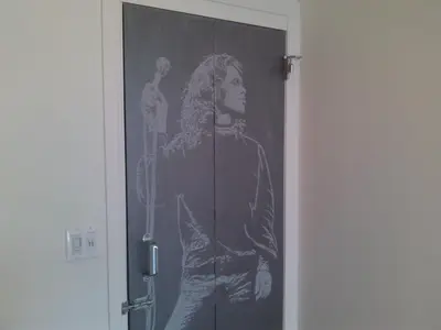 a drawing of a woman holding a microphone on a door at Ocean Front Vortex Female Hostel private rooms Free bikes in Los Angeles