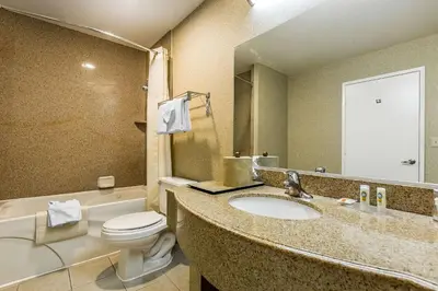 a bathroom with a sink and a toilet at Quality Inn Near China Lake Naval Station in Ridgecrest