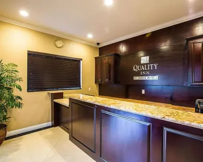 a large kitchen with a counter in a house at Quality Inn Downey in Downey