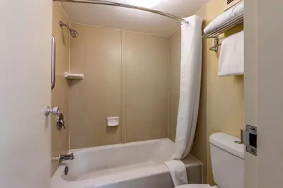 a bathroom with a white tub and a toilet at Quality Inn Barstow Route 66 in Barstow