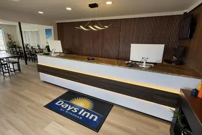 a bar in a restaurant with a sign on the counter at Days Inn by Wyndham Ridgecrest near China Lake Naval Station in Ridgecrest