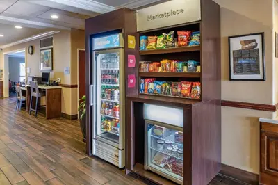 a store with a refrigerator and shelves of food at Comfort Suites Near Six Flags Magic Mountain in Stevenson Ranch