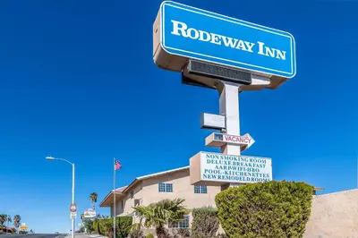 a blue street sign on a road way inn at Rodeway Inn Barstow Route 66 in Barstow