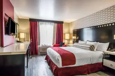 a hotel room with a large bed and a window at Tilt Hotel Universal-Hollywood, an AGA Collection Hotel in Los Angeles