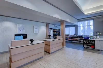 a large room with a hair salon with counters at Hilton Garden Inn Anaheim/Garden Grove in Anaheim