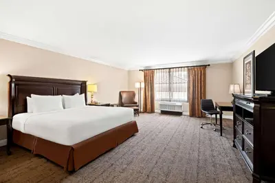 a hotel room with a bed and a desk at Best Western Ontario Mills Mall in Ontario